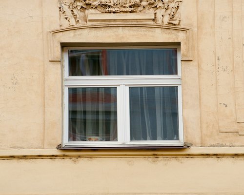 Person doing morning meditation by the window